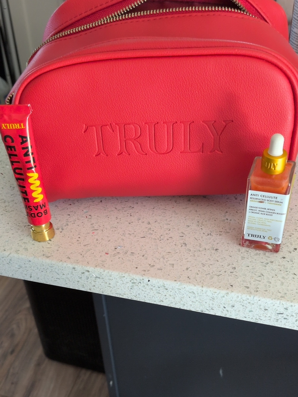 TRULY Vibrant Coral Pink Makeup Bag with Anti-Cellulite Serum
